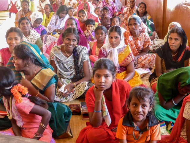 Colourful ladies at rural church service in India